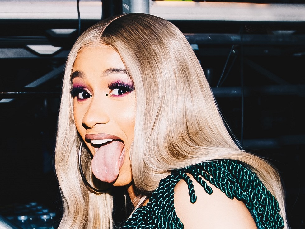 Cardi B sticking her tongue out