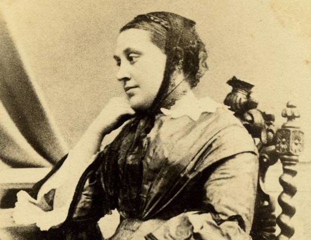 portrait of marie hinrichs sitting in an ornate chair and looking to her right