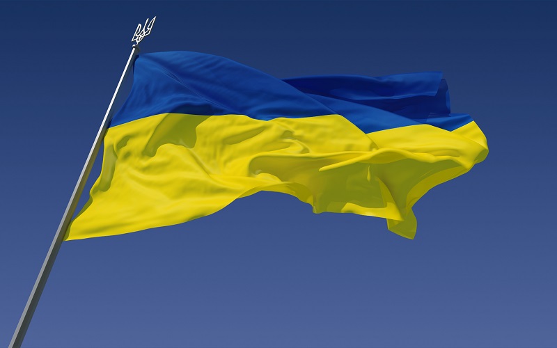 The flag of Ukraine (blocked blue on top and yellow on bottom) waving in the wind